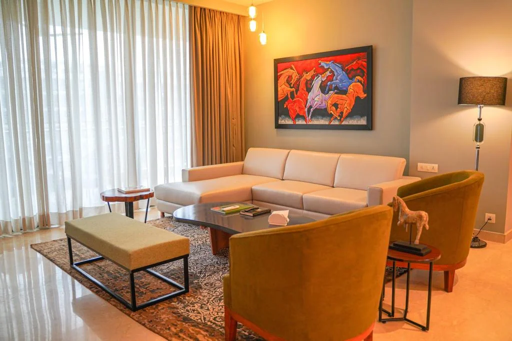Sophisticated home interior with a rich color palette, soft lighting, and premium furniture.